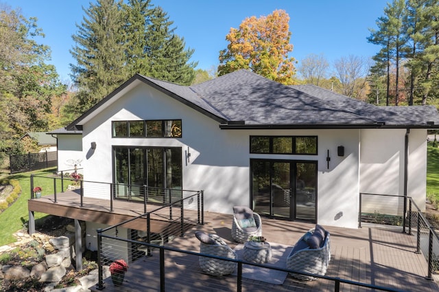 back of house with outdoor lounge area, a balcony, and a patio