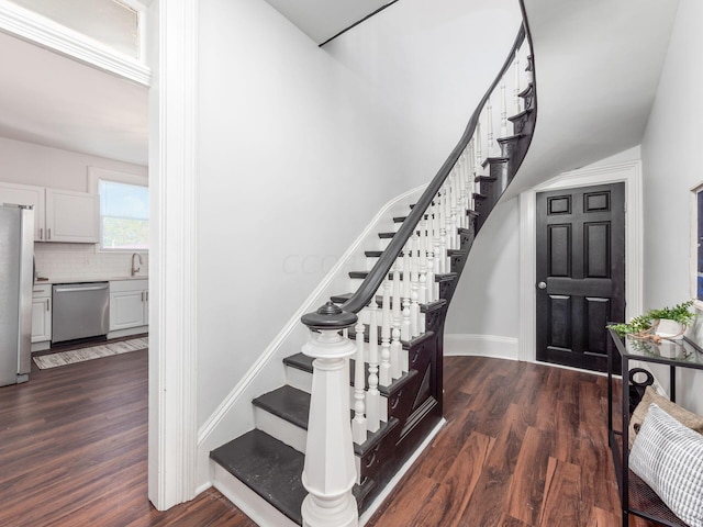 stairway with wood-type flooring