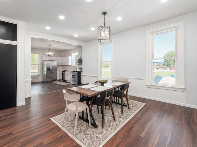 dining space with dark wood-type flooring