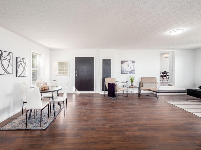 interior space featuring dark hardwood / wood-style flooring and a textured ceiling