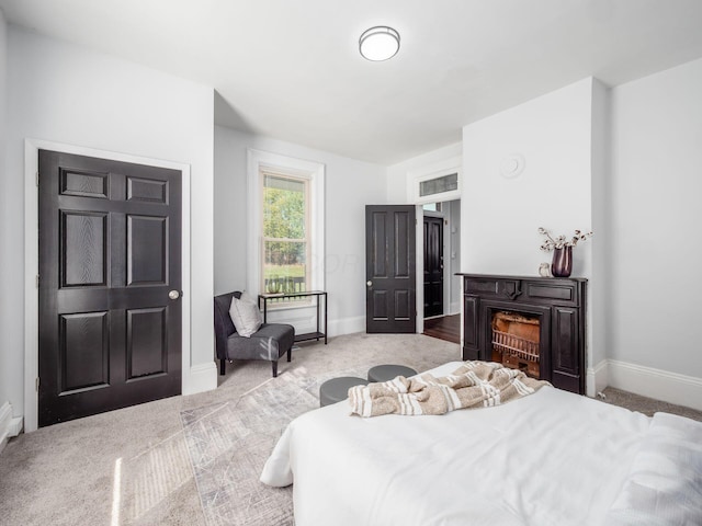 bedroom with light colored carpet