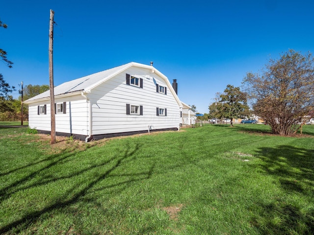 view of home's exterior featuring a yard