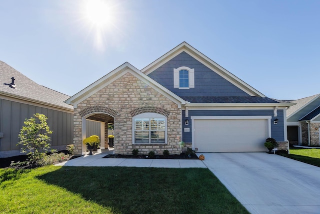 view of front of property with a garage and a front yard