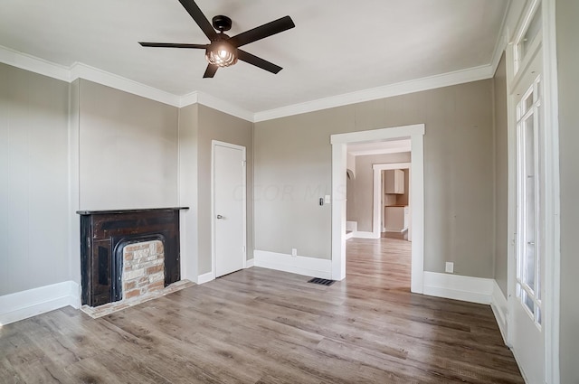 unfurnished living room featuring ceiling fan, hardwood / wood-style floors, and crown molding