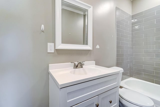 full bathroom featuring vanity, toilet, and tiled shower / bath combo