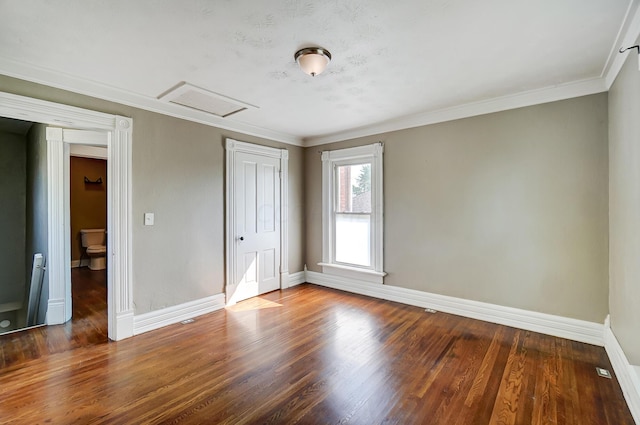 unfurnished bedroom featuring ornamental molding and hardwood / wood-style flooring