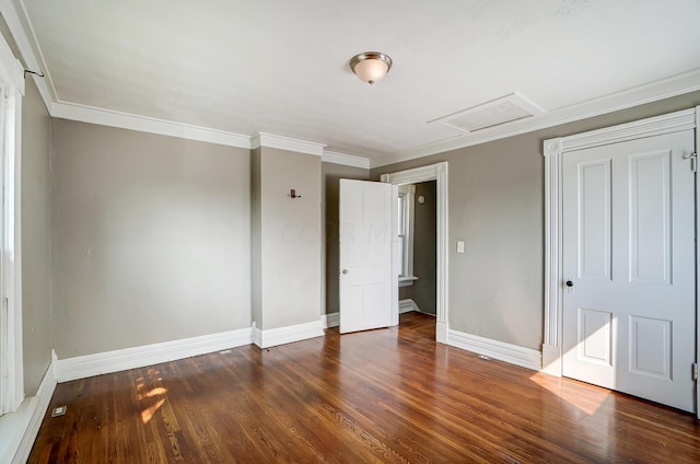 unfurnished bedroom featuring dark hardwood / wood-style floors and ornamental molding