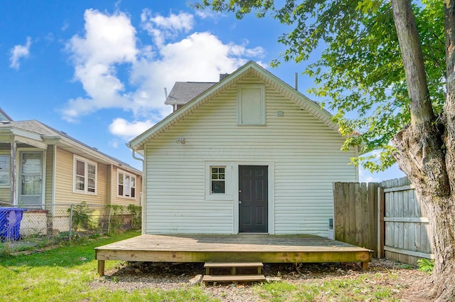 back of house featuring a deck