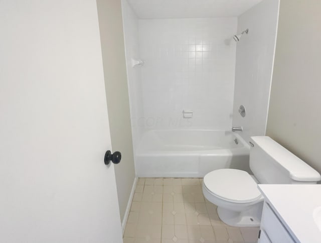 full bathroom with toilet, vanity, tile patterned floors, and tiled shower / bath