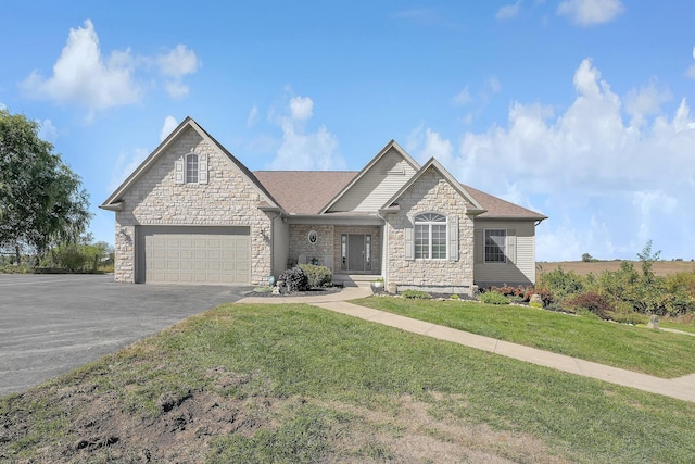 view of front facade featuring a front lawn and a garage