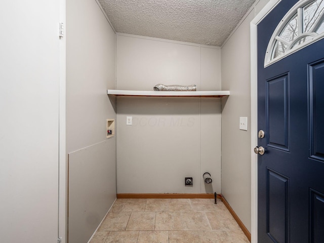 clothes washing area with washer hookup, a textured ceiling, and hookup for an electric dryer