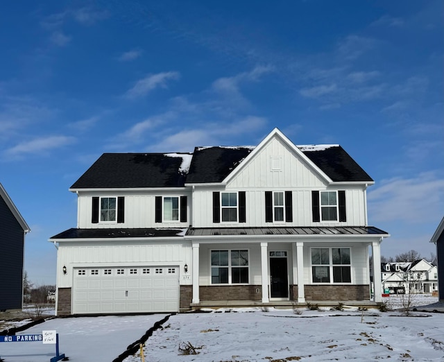 modern farmhouse with a porch and a garage