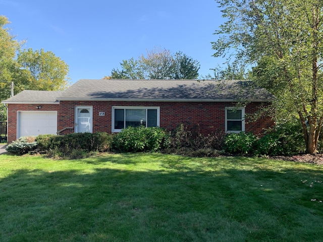 single story home with a garage and a front lawn