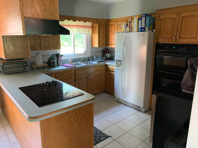 kitchen with kitchen peninsula, extractor fan, sink, black appliances, and light tile patterned floors