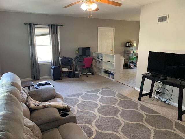 living room featuring light colored carpet and ceiling fan