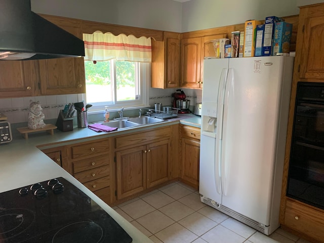 kitchen with backsplash, black appliances, sink, range hood, and light tile patterned flooring