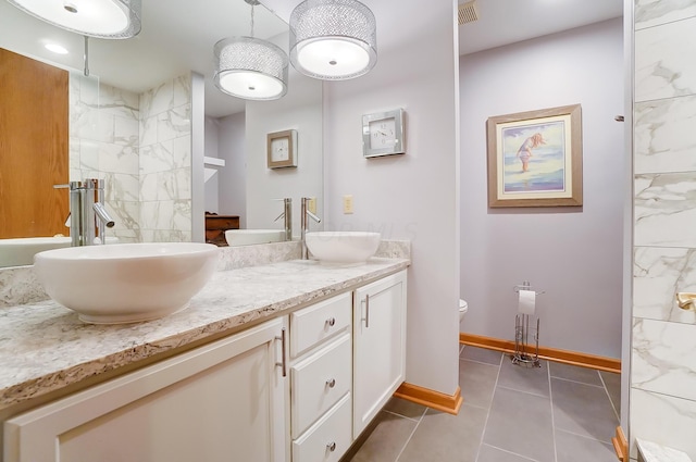 bathroom with walk in shower, tile patterned flooring, vanity, and toilet