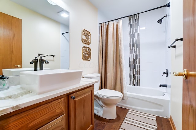 full bathroom featuring shower / bath combination with curtain, vanity, wood-type flooring, and toilet