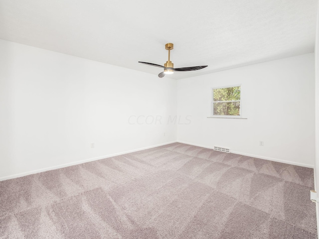 carpeted empty room with ceiling fan