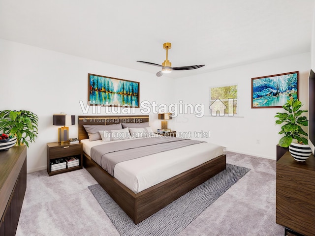 bedroom with ceiling fan and light carpet