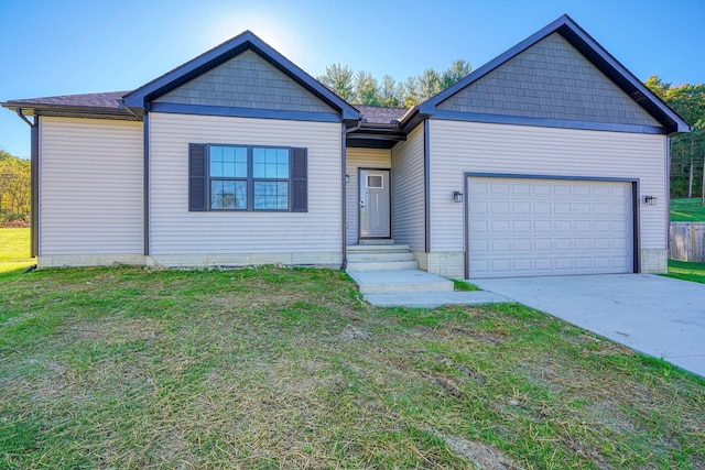 view of front of home with a front yard and a garage