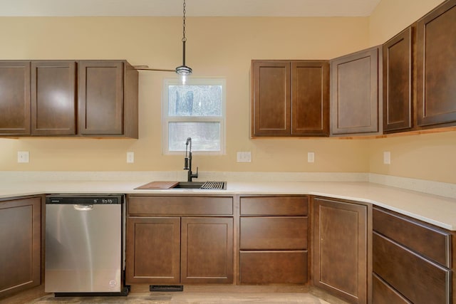 32360 Redbud Ln, Logan, OH 43138 - kitchen featuring stainless steel dishwasher, light countertops, pendant lighting, and dark brown cabinetry