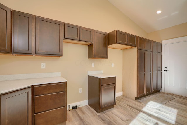 32360 Redbud Ln, Logan, OH 43138 - kitchen with light wood-style floors, lofted ceiling, light countertops, and recessed lighting