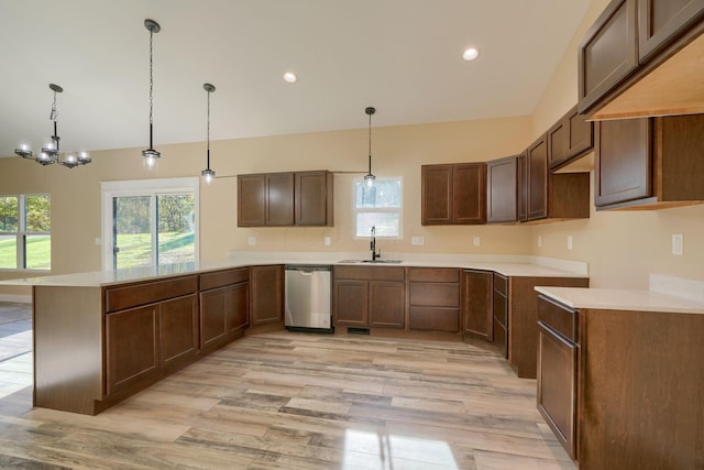 32360 Redbud Ln, Logan, OH 43138 - kitchen featuring dishwasher, a peninsula, light wood finished floors, pendant lighting, and a chandelier