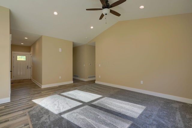 spare room with hardwood / wood-style floors, ceiling fan, and lofted ceiling