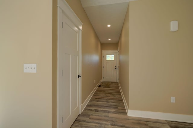 hallway with hardwood / wood-style flooring