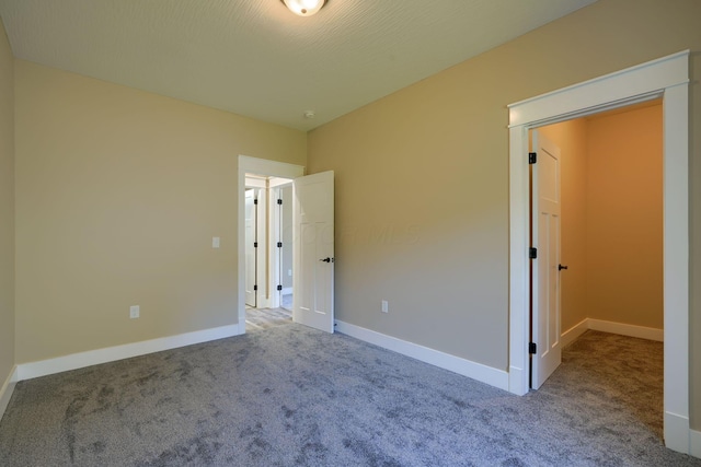 unfurnished bedroom with carpet flooring