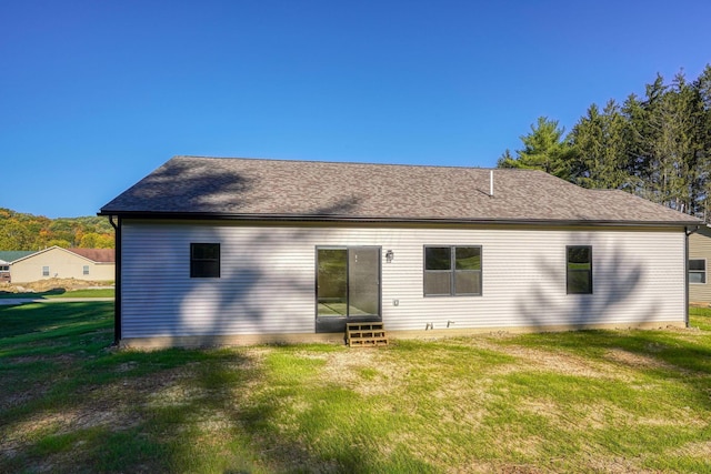 32360 Redbud Ln, Logan, OH 43138 - back of house with entry steps, a yard, and roof with shingles