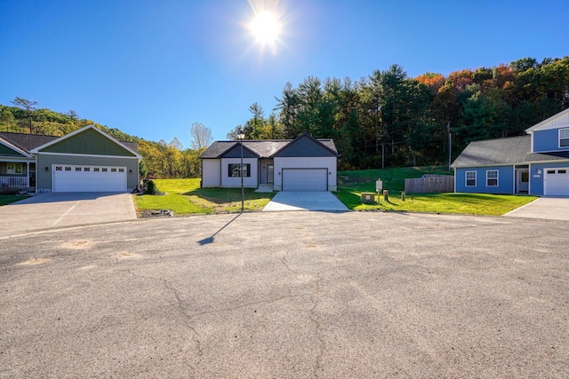 32360 Redbud Ln, Logan, OH 43138 - view of front of house with a front lawn and a garage