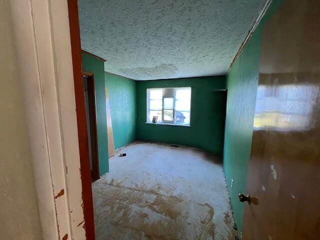 empty room with a textured ceiling