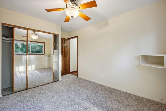 unfurnished bedroom with carpet floors, a closet, and ceiling fan