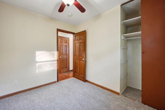 unfurnished bedroom with ceiling fan, light colored carpet, and a closet