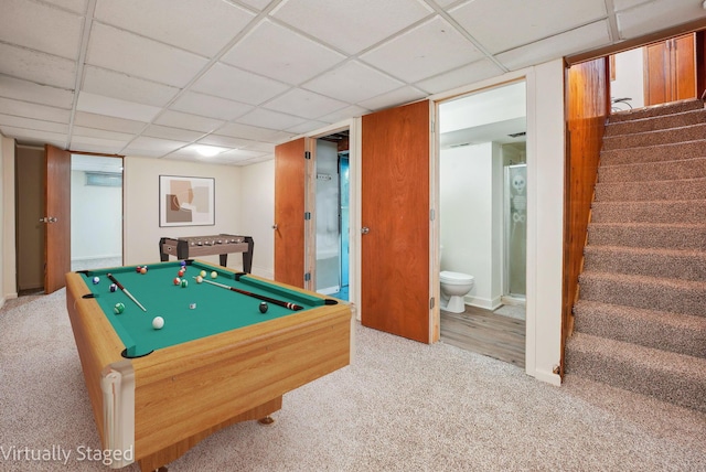 playroom with carpet flooring and a drop ceiling