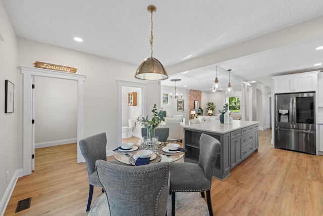 dining room with light hardwood / wood-style floors