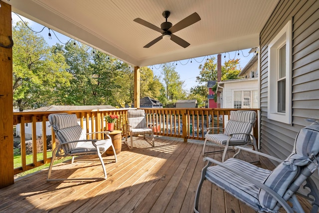 wooden terrace featuring ceiling fan