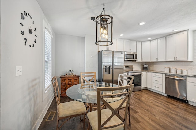 kitchen featuring white cabinets, plenty of natural light, and stainless steel appliances