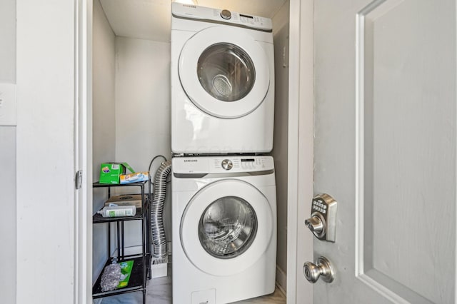 laundry room featuring stacked washer and clothes dryer