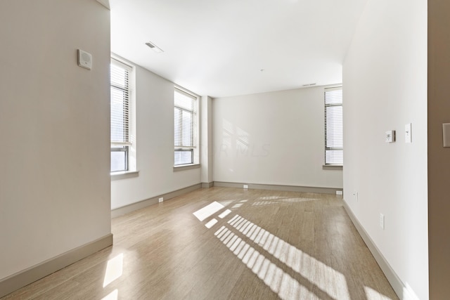 unfurnished room featuring light hardwood / wood-style flooring