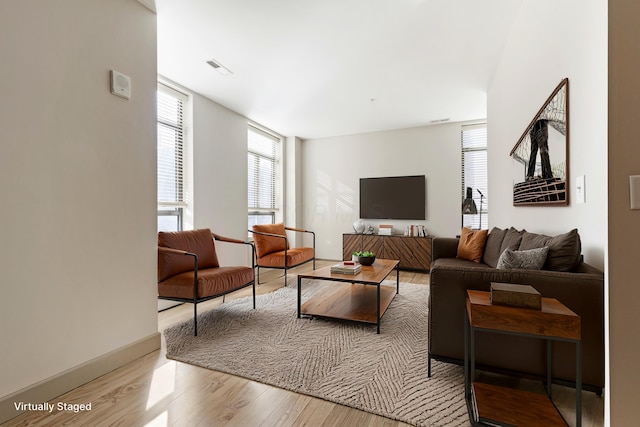 living room with light hardwood / wood-style floors