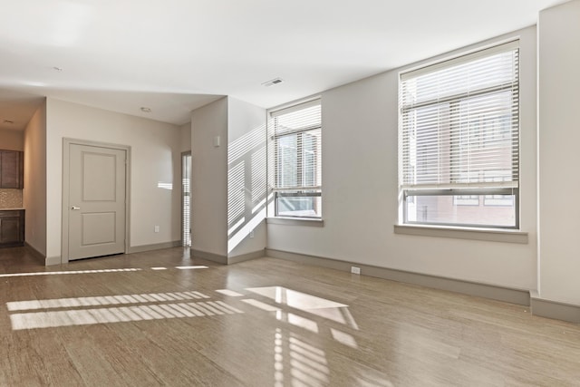 unfurnished living room with light hardwood / wood-style floors