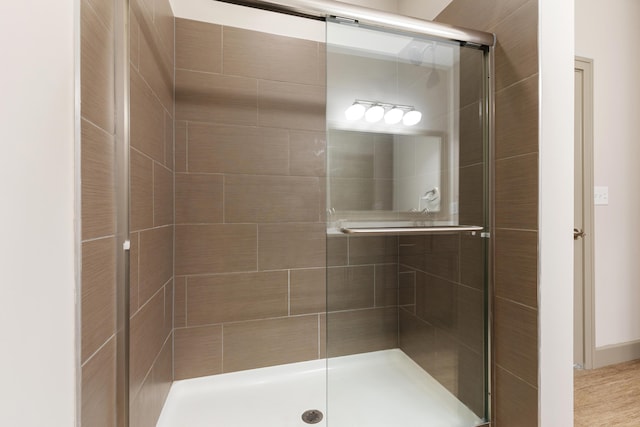 bathroom featuring an enclosed shower