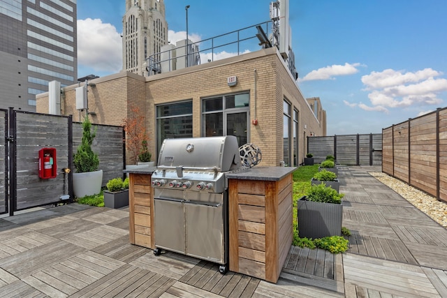 wooden deck with area for grilling and grilling area