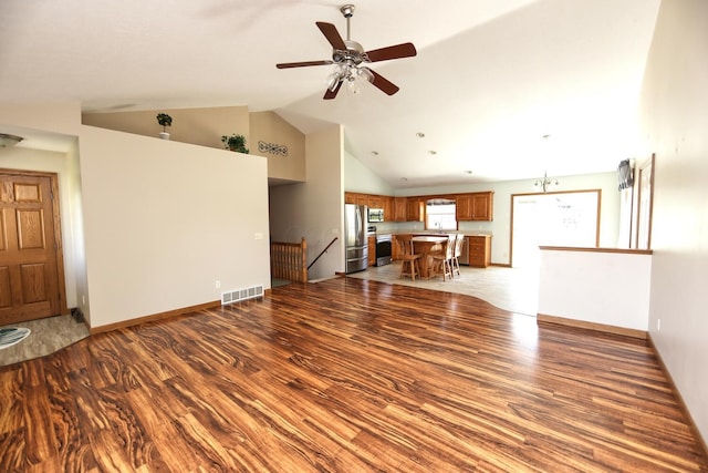 unfurnished living room featuring high vaulted ceiling, a ceiling fan, a sink, light wood-style flooring, and visible vents