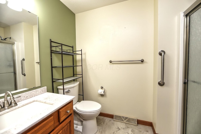 bathroom featuring vanity, baseboards, toilet, an enclosed shower, and visible vents
