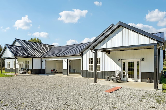 back of house with french doors, ceiling fan, and a patio area