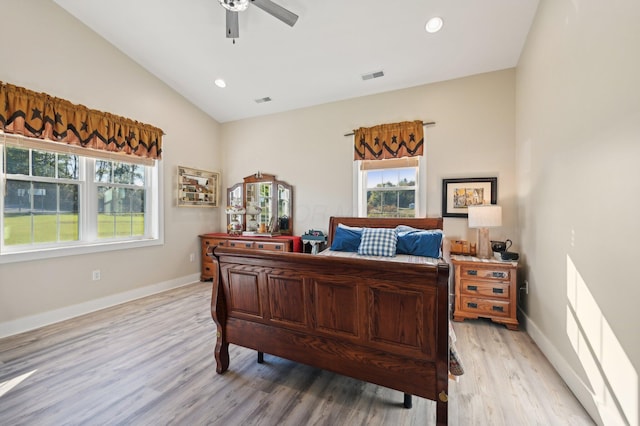 bedroom featuring ceiling fan, lofted ceiling, and light wood-type flooring